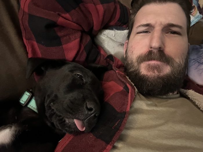 Mike Box at home with his dog